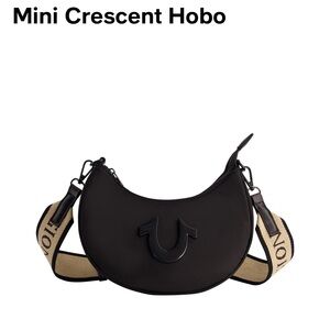 NWT Black Logo Strap w/faux leather & features a top zipper, with coin purse.